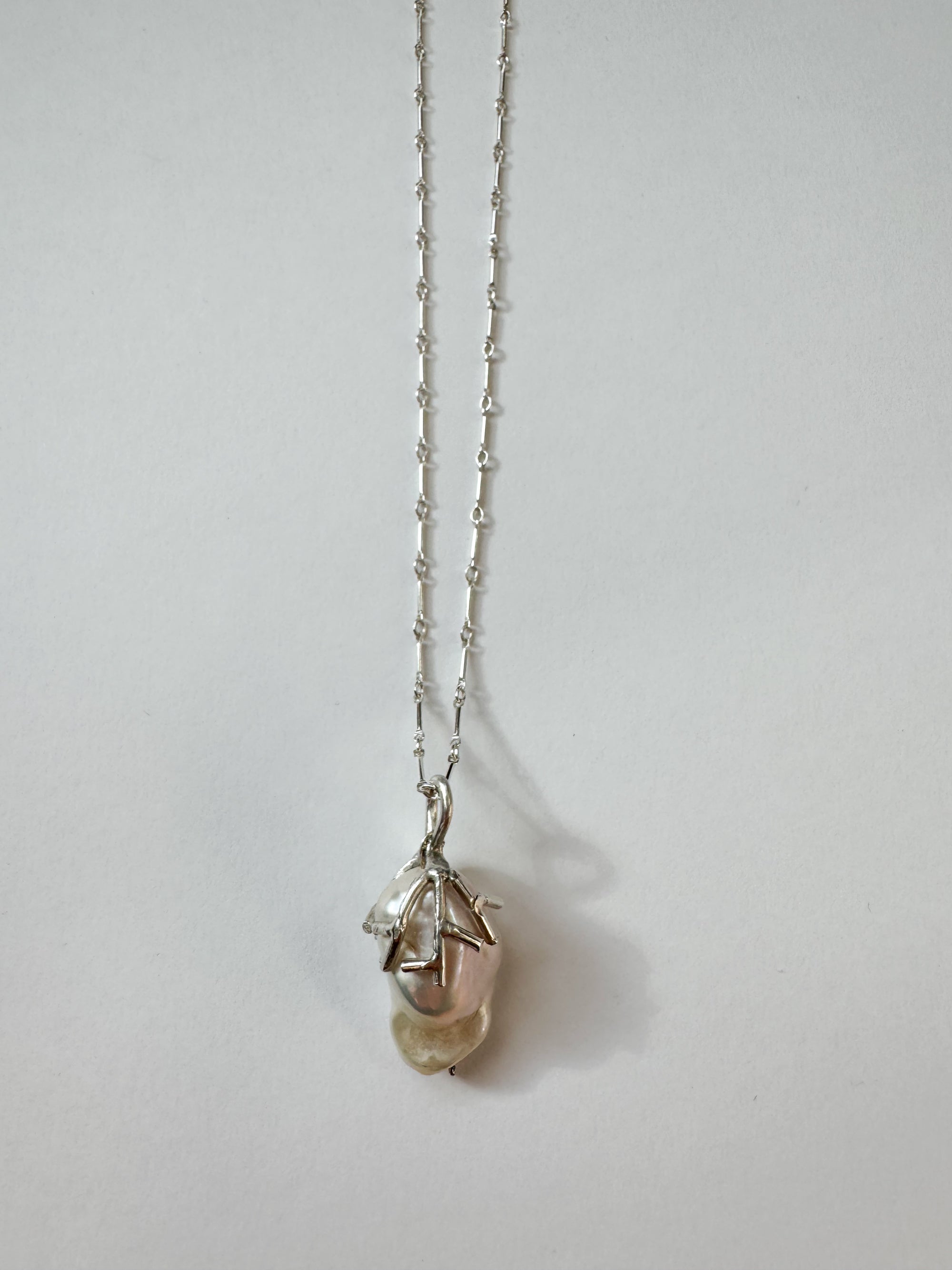 Raven baroque pearl necklace with adjustable chain and handcrafted with recycled materials in new york city 